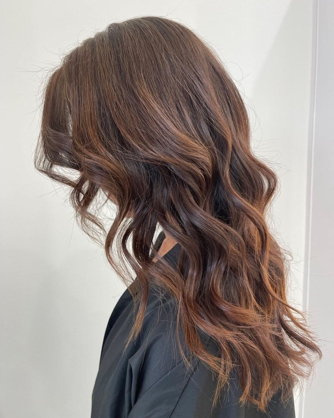 Glossy brunette wave portrait